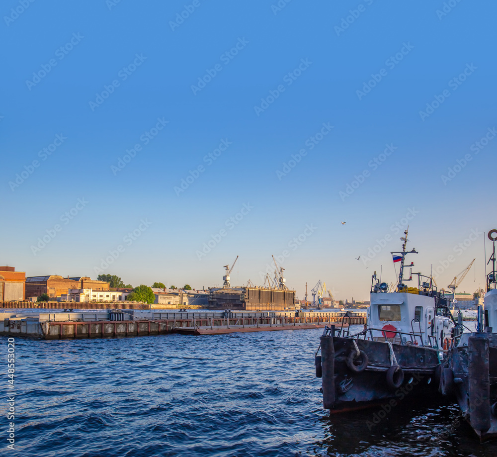 View of the port, panorama of the summer sunset of St. Petersburg. Russia.