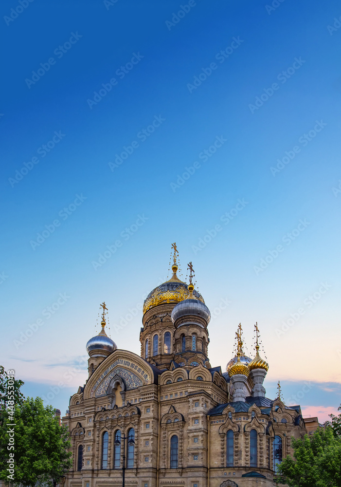 Vasilyevsky island embankment overlooking the Church of the assumption of the blessed virgin. St. Petersburg, Russia.
