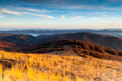 Sunrise seen from the summit of Po  onina Wetli  ska towards the Bieszczady peaks and the summit of Po  onina Cary  ska  the Bieszczady forest  the Bieszczady mountains  the Carpathians