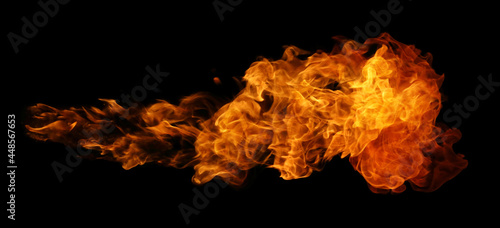 Quadro su tela Fire and burning flame of explosive fireball isolated on dark background for gra