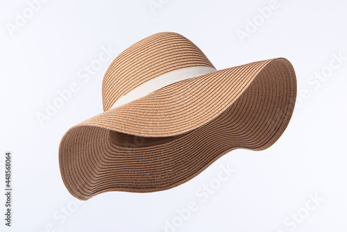 Vintage Panama hat, Womens summer yellow straw hat with the white ribbon isolated on white background. photo