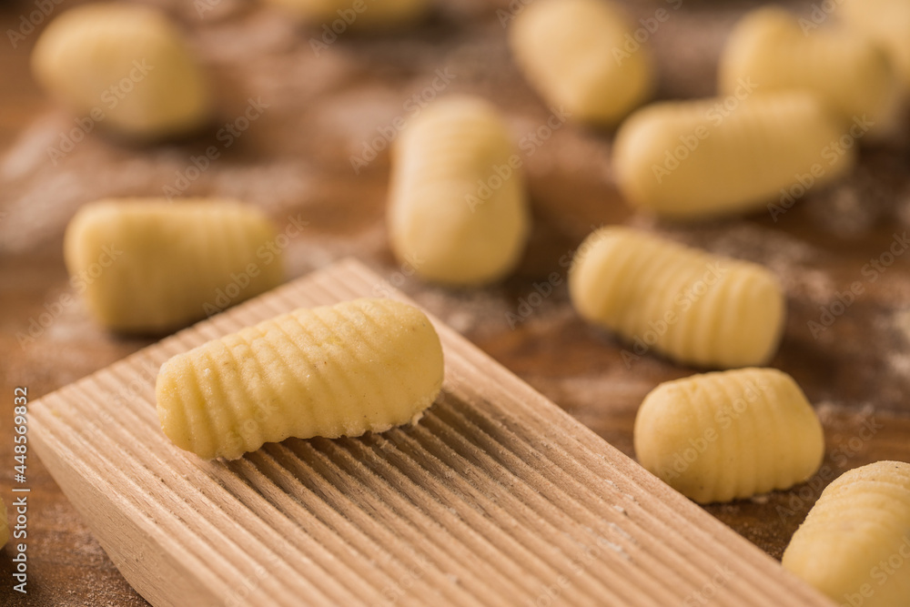 Raw pieces of dough near ribbed board Raw pieces of dough near ribbed board