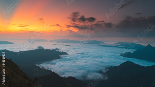 Beautiful sunrise over mountain with fog in the morning