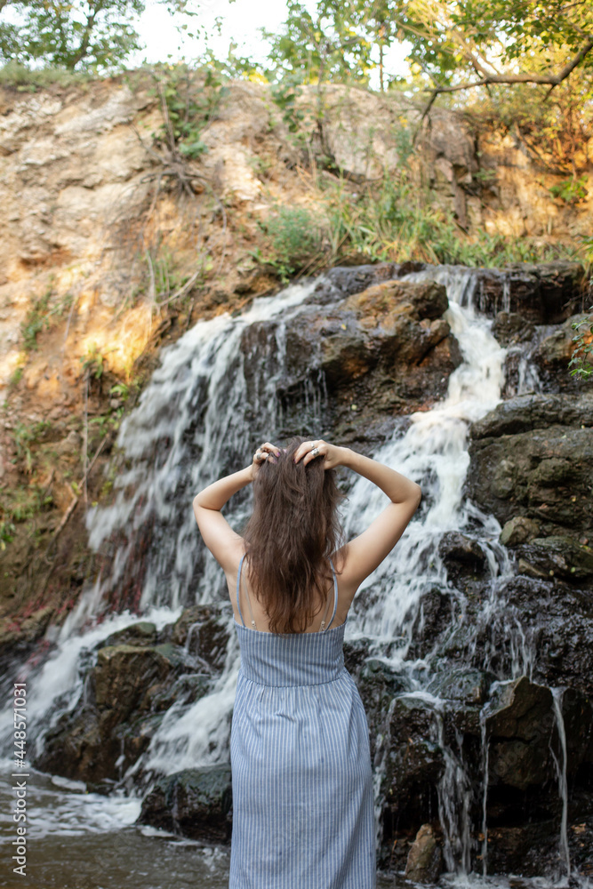 girl near waterfalls. girl in a nature girl near waterfalls. girl in a nature