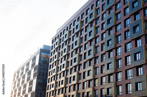 New apartment building against the sky. Windows of a residential building