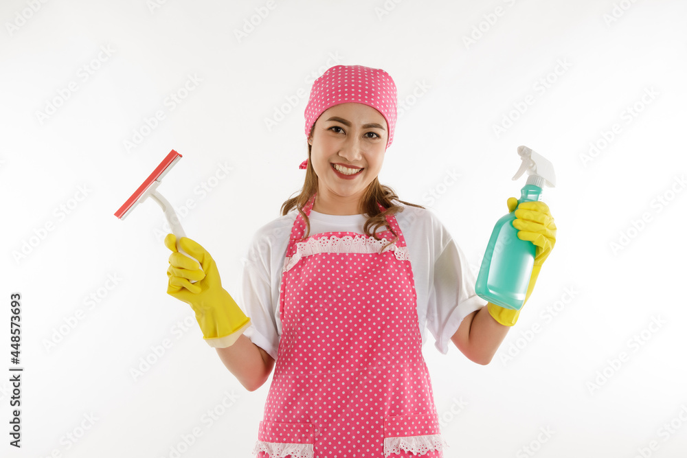 Portrait of young asian maid wearing yellow grove and holding cleaning solution splay Portrait of young asian maid wearing yellow grove and holding cleaning solution splay