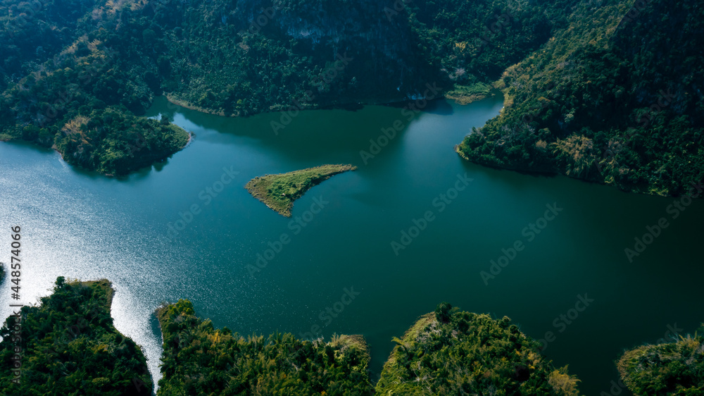 national reservoir or dam curved in the middle of the valley at chiang rai thailand national reservoir or dam curved in the middle of the valley at chiang rai thailand