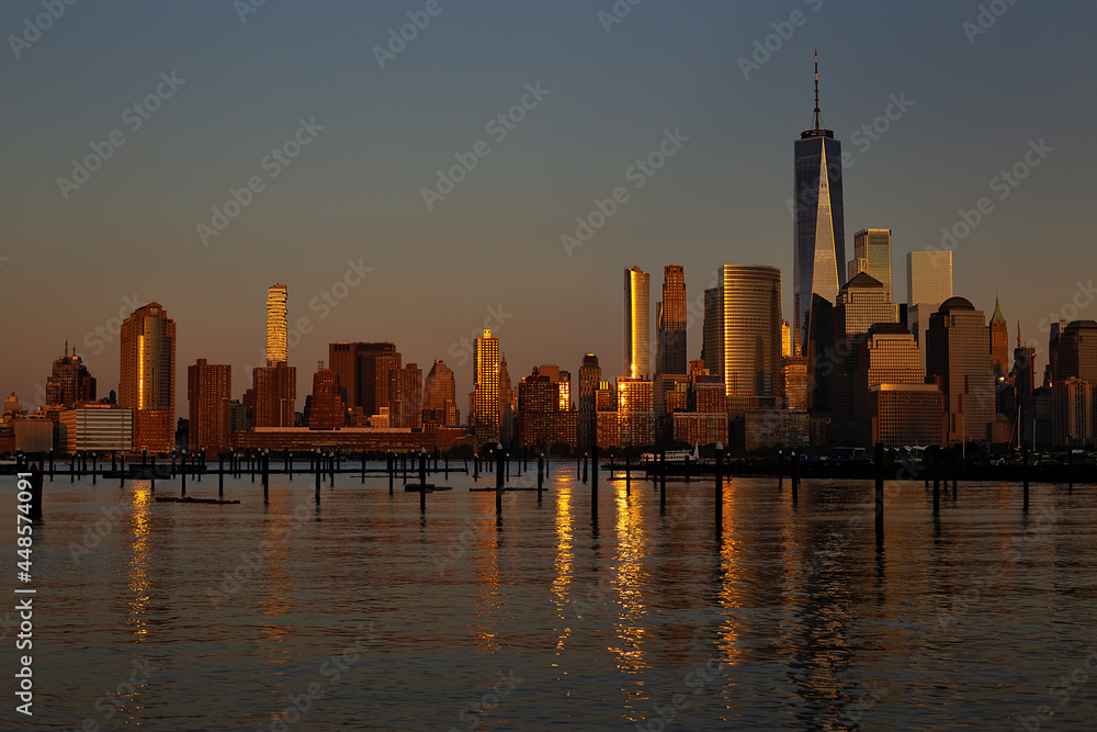 New York City - Manhattan in Golden Hour - Hudson River  on Foreground.  Beautiful cityscape