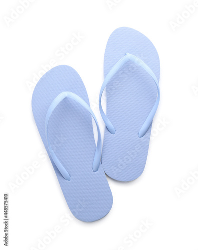 Stylish blue flip flops on white background, top view