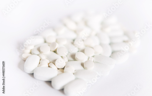 White pills on a White background. Healthcare and medicine. 