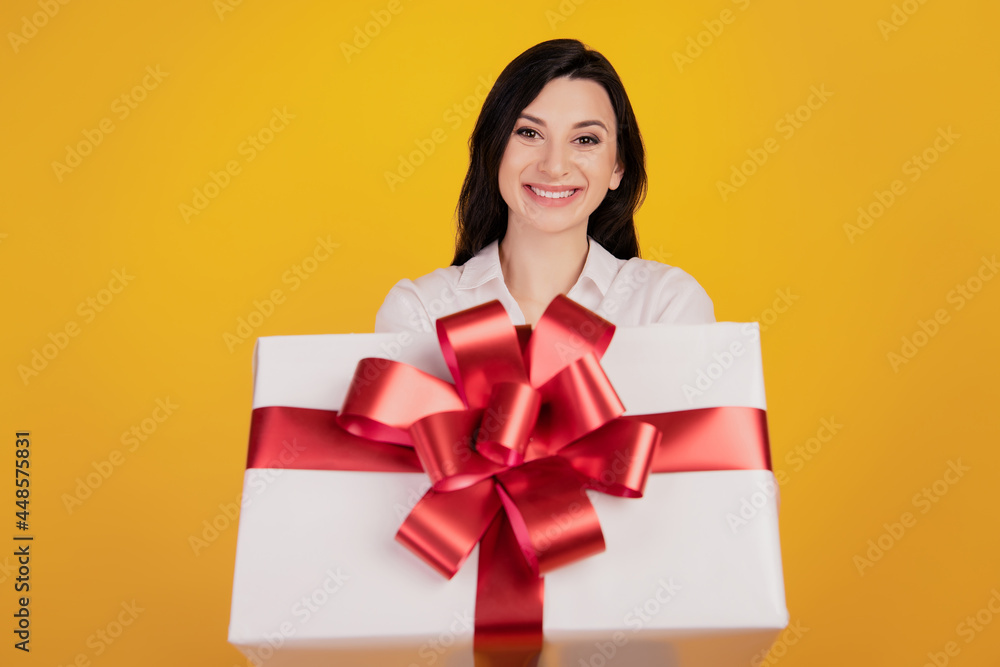 Portrait of reliable lovely cute girl receive gift present box on yellow background Portrait of reliable lovely cute girl receive gift present box on yellow background