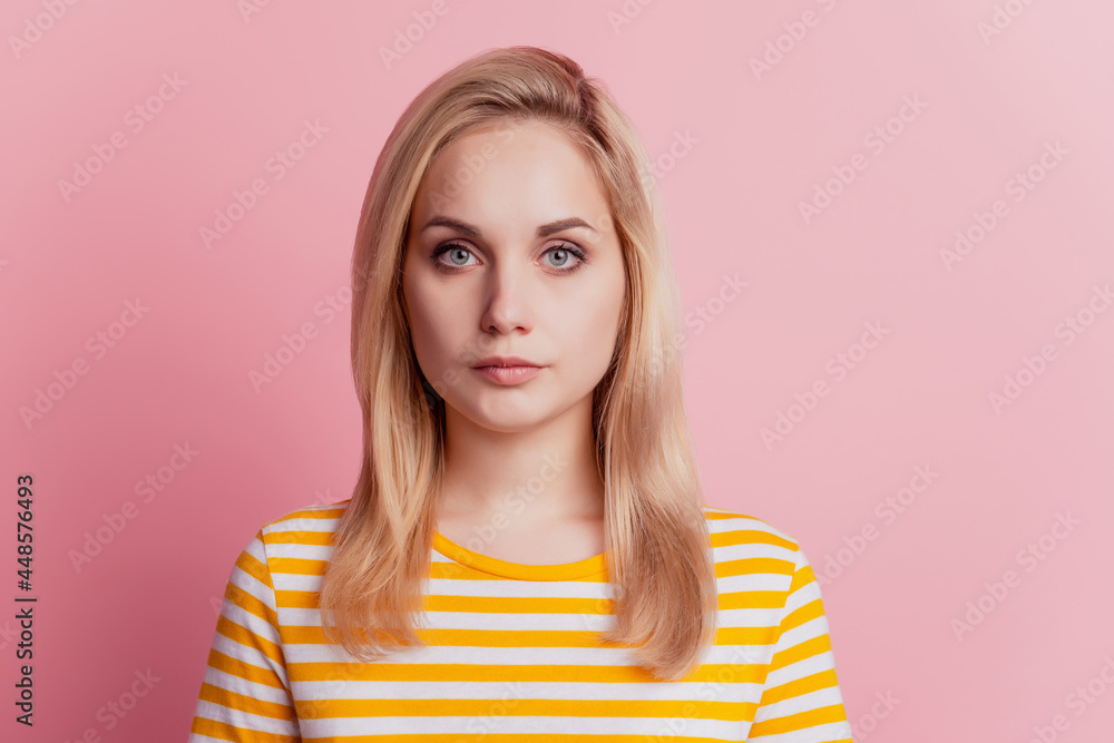Portrait of calm serious focused girl look camera on pink background Portrait of calm serious focused girl look camera on pink background