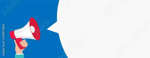 Hand holding megaphone with bubble speech. Vector illustration