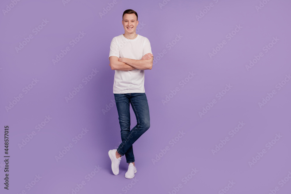 Portrait of self-assured successful businessman folded arms posing on purple background Portrait of self-assured successful businessman folded arms posing on purple background