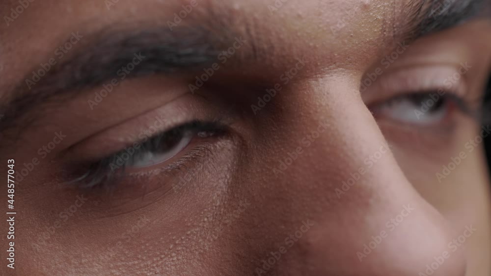african American man face. Close up macro zoom shot of eyes. Handsome black guy with beautiful face. Young male eyes opening while look at the windows, having long nice Eyelashes. Portrait slow motion african American man face. Close up macro zoom shot of eyes. Handsome black guy with beautiful face. Young male eyes opening while look at the windows, having long nice Eyelashes. Portrait slow motion