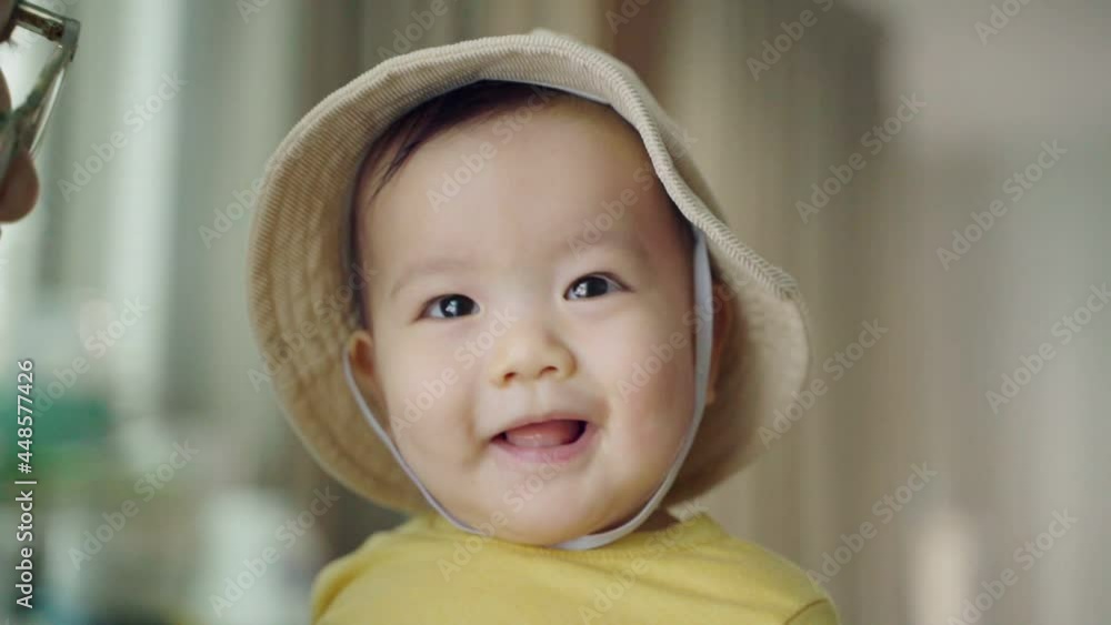 Cute Smiling Happy Asian baby boy playing with his mother. Cute Smiling Happy Asian baby boy playing with his mother.