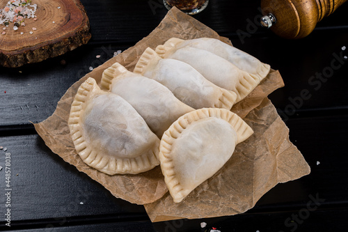 Frozen russian crude pelmen or dumpling photo