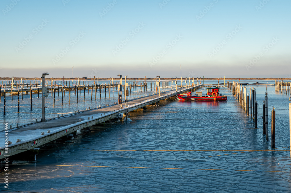Boat pier on a freezing sunny day 