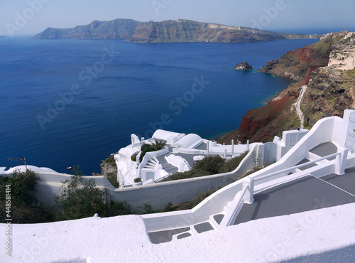 White and grey stairs steps to blue aegean sea santorini island