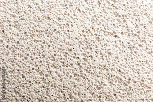 Texture of white pumice stone as background, closeup photo