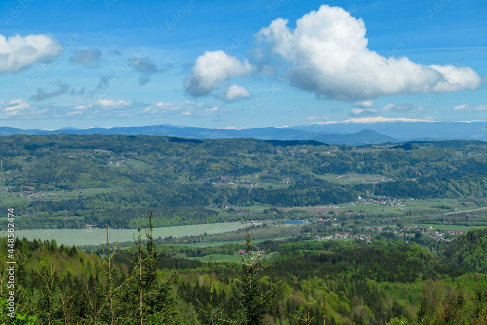A panoramic view on Ferlacher Stausee, Austrian Alps. The river Drava is running through the valley. In the back the mountain chain Koralpe can be seen. Wanderlust A panoramic view on Ferlacher Stausee, Austrian Alps. The river Drava is running through the valley. In the back the mountain chain Koralpe can be seen. Wanderlust