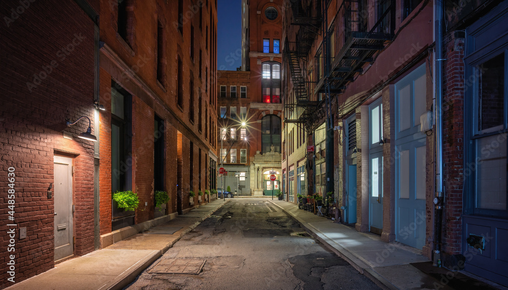 narrow street at night Manhattan New York City