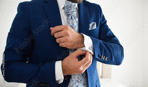 a detail of a groom's shirt cuffs