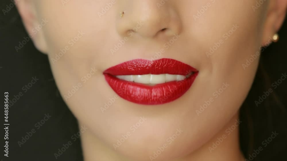4K Closeup of a beautiful woman lips with beautiful red make up sending air kiss . Close up of girl's mouth having flirty emotions and sending air kiss . 4K Closeup of a beautiful woman lips with beautiful red make up sending air kiss . Close up of girl's mouth having flirty emotions and sending air kiss .