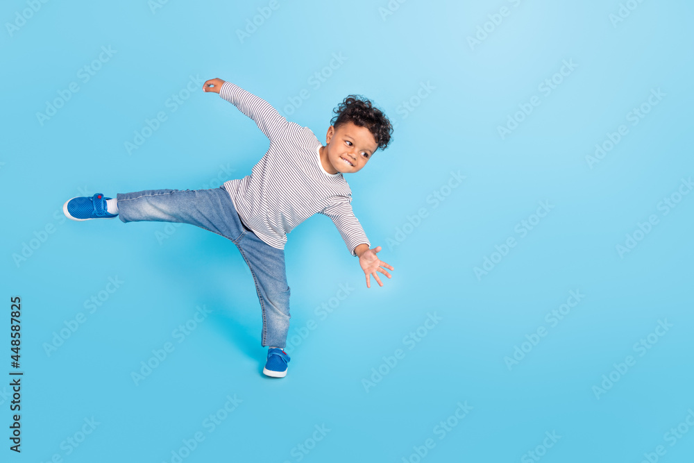Full length body size view of attractive cheerful sporty boy dancing break having fun isolated over bright blue color background