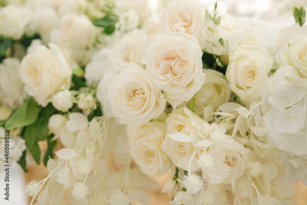 Beautiful white and green floral decoration on wedding table in restauratnt Beautiful white and green floral decoration on wedding table in restauratnt