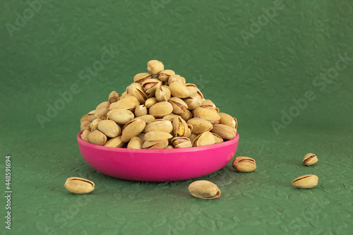Pistachio Plate Pile isolated green background
