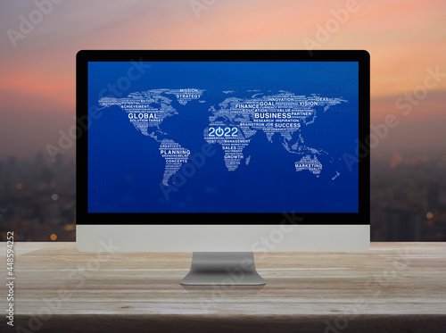 2022 start up business icon with global words map on computer screen on table over blur of cityscape on warm light sundown, Happy new year 2022 start up, Elements of this image furnished by NASA