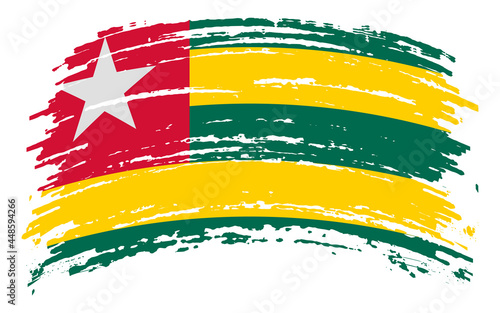 Togo flag in grunge brush stroke, vector