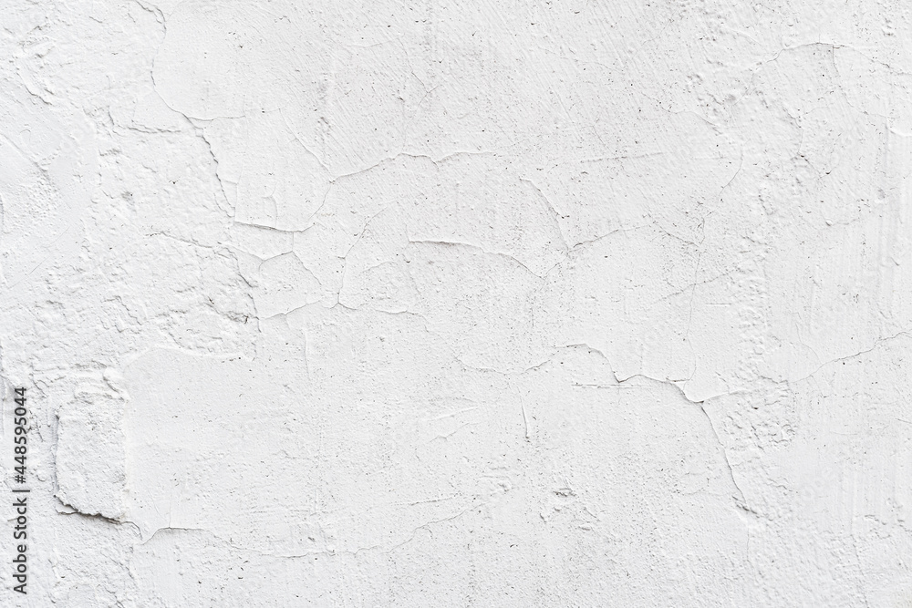 Texture of white painted wall, chipped, scratches. Stucco wall close-up Texture of white painted wall, chipped, scratches. Stucco wall close-up
