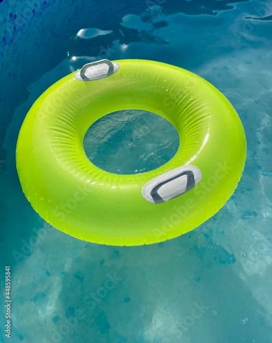 green float in the pool. summer
