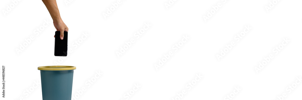 Banner,man hand throws cell phone into trash can on white background. Banner,man hand throws cell phone into trash can on white background.