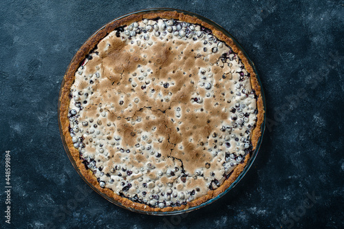 Homemade organic blueberry pie dessert ready to eat, close up. Blueberry meringue pie