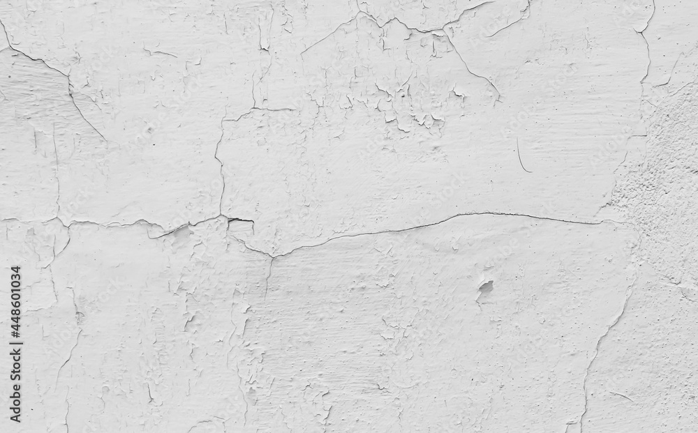 white cracked wall with visible details. background