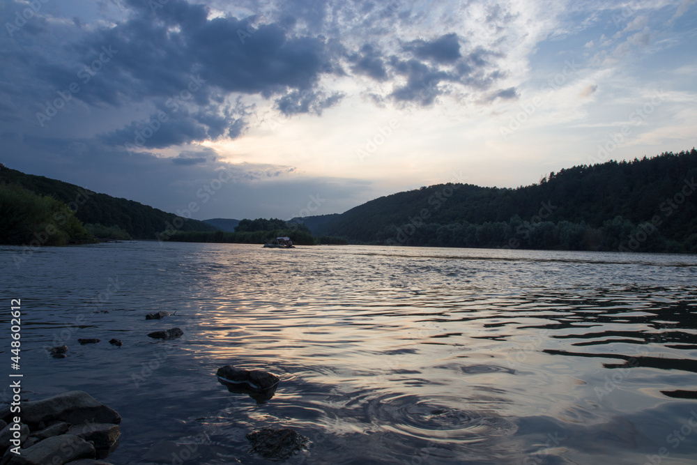Fototapeta premium sunset among the clouds on the river