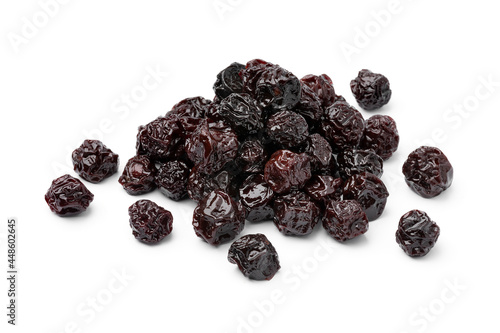Heap of sweet red dried cherries close up isolated on white background 