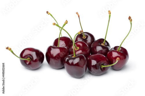 Heap of fresh red ripe juicy cherries isolated close up on white background 