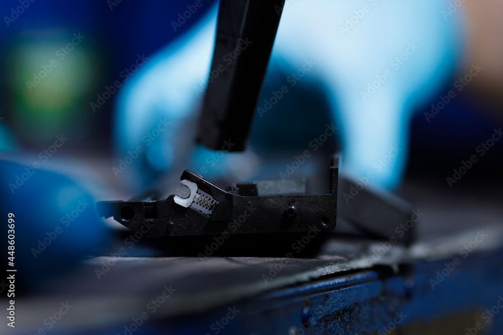 hands repairing laser toner cartridge hands repairing laser toner cartridge