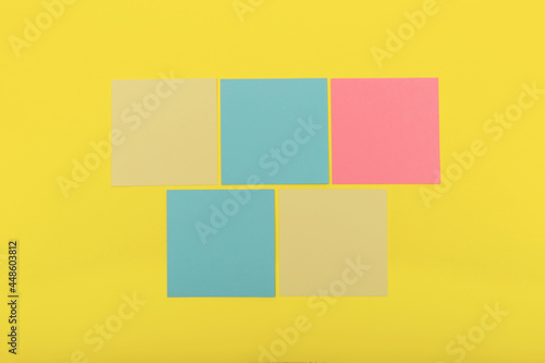 Colorful sticky notes on yellow background, flat lay