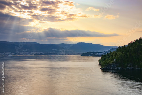 Beautiful sunrise over the city of Bergen with sunlight shining over the clouds, Bergen, Norway, Baltic cruise on the North Sea.