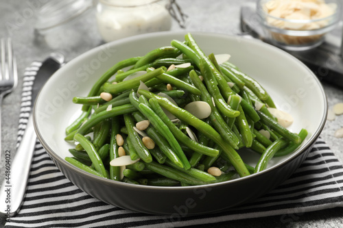 Tasty salad with green beans served on table
