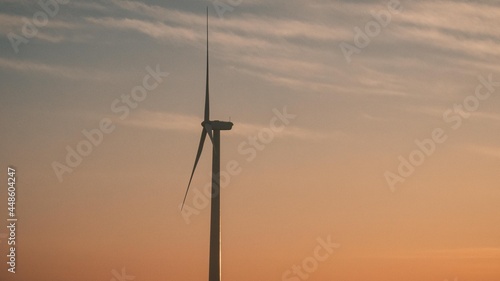 Renewable energy source, Sunrise on a wind turbine.