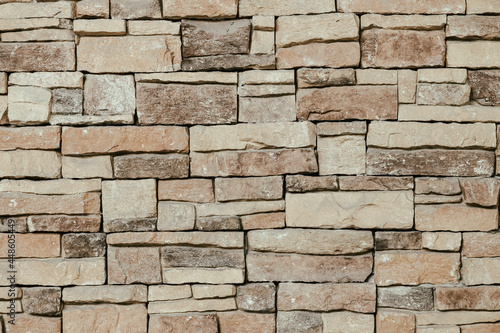 Mosaic stone rock sandstone puzzle tile texture pattern building exterior decoration wallpaper background.