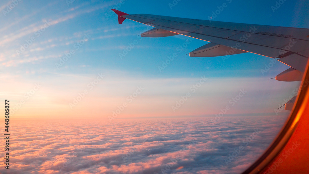 Fototapeta premium airplane in the sky at sunset