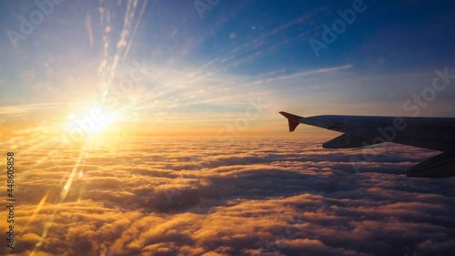airplane in the sky at sunset © Александр Кудрявцев