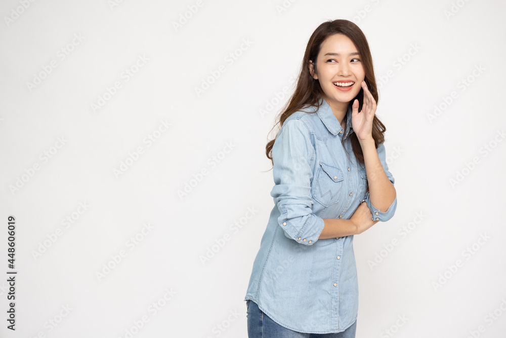 Portrait of excited happy young asian woman wearing jean shirt isolated over white background, Wow and surprised concept Portrait of excited happy young asian woman wearing jean shirt isolated over white background, Wow and surprised concept